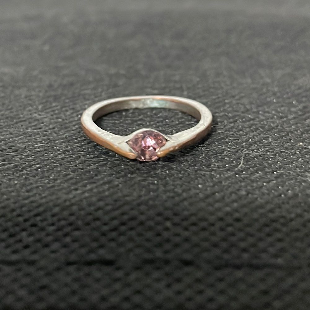Skinny ring with a lite purple gem